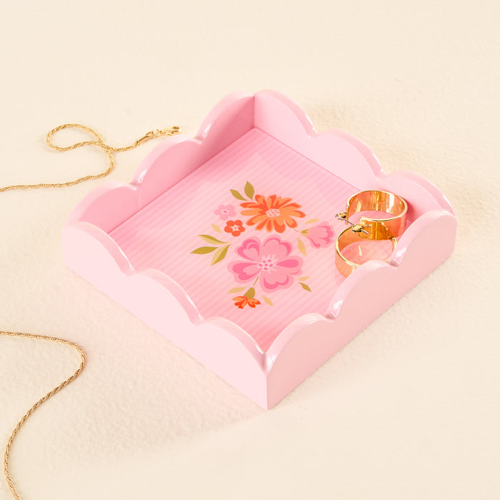 The Dainty Floral Pink Scallop Trinket Tray by the-darling-effect holds two gold rings as a charming jewelry organizer, while a gold necklace lies on the soft cream-colored surface beside this elegant vanity tray.