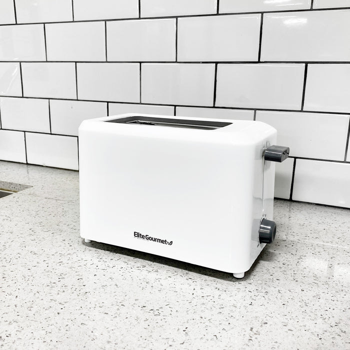 The 2 slice white toaster placing on a marble countertop.