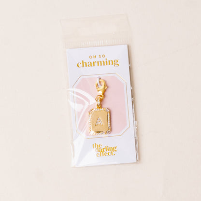 A Jewelry Charm Initial Letter Gold by the-darling-effect features a gold-plated “A” with rhinestone border, lobster clasp, and comes on an “oh so charming” branded card—perfect for personalized style.