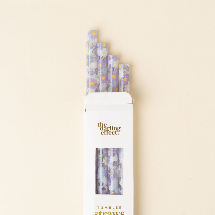 Five Bouquet Beauty Purple 40 oz Tumbler Straws by the-darling-effect are partially pulled from their white box, set against a light beige background. The set is BPA-free and reusable.