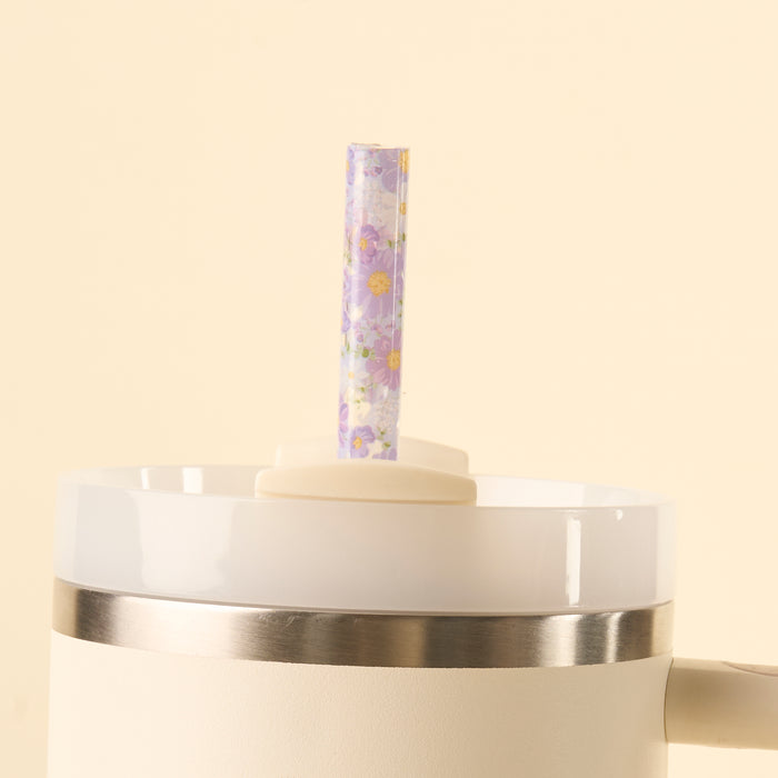 The-darling-effect’s Bouquet Beauty Purple 40 oz Tumbler Straw Set features BPA-free reusable straws with a clear design and small purple flowers with yellow centers, adding charm to any white tumbler lid or straw set.