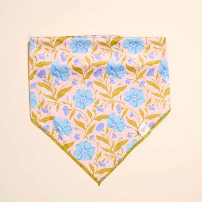 The Darling Effect’s Bow-Wow Pet Bandana-Poppin' Petals Aqua features a cotton design with an aqua background and a vibrant floral pattern, making it the perfect stylish accessory for your pet.