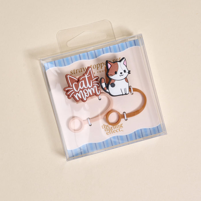 The Darling Effect Cat Mom Straw Topper Set includes leak-resistant silicone toppers with a "Cat Mom" design and cute white cat illustration, displayed on blue-striped backing—perfect drinkware accessories for cat lovers.
