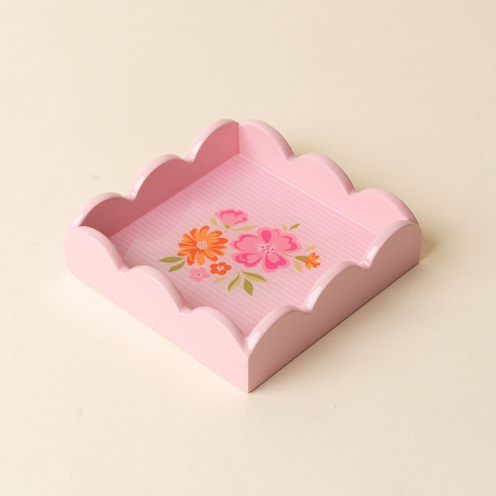 The Dainty Floral Pink Scallop Trinket Tray by the-darling-effect features scalloped edges and pink and orange florals on a striped background—perfect as a jewelry organizer or vanity tray for any neutral space.