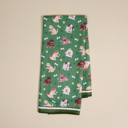 The Darling Effect's Dog Days Waffle Tea Towel features a green cartoon dog, white bone, and yellow dot pattern—absorbent and ideal for everyday kitchen use.