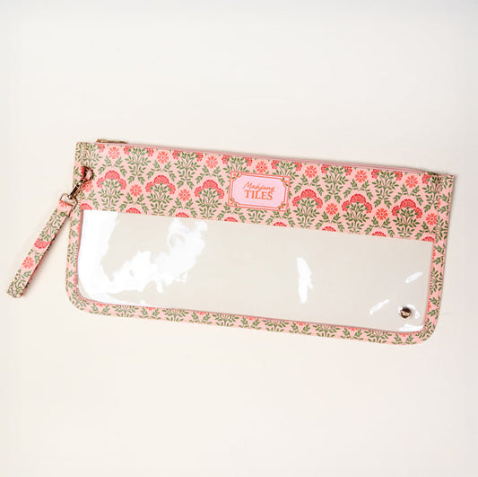 The Darling Effect's Everbloom Dusty Rose Mahjong Tile Keeper Pouch features a floral pattern in pink and gray, a wrist strap, clear front window, and a pink "Happy TILES" label—perfect for stylish Mahjong tile storage.