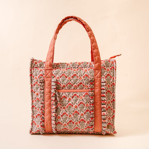 The Darling Effect's Everbloom Dusty Rose The Everyday Quilted Tote Bag features a pink floral print, coral trim, and zippered pocket—perfect for carrying your essentials in style.
