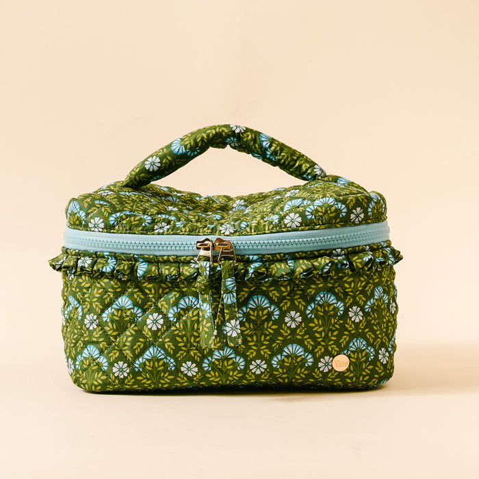 The Darling Effect’s Everbloom Forest Green Glam & Go Quilted Cosmetic Bag features a vintage floral pattern and blue ruffled zipper—perfect for stylish travel organization.