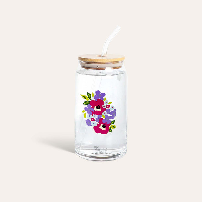 The Darling Effect Floral Purple 20 oz Glass features a bamboo lid, reusable straw, and a vibrant red, purple, and blue floral design—perfect as an iced coffee cup to brighten your day.