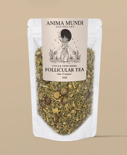 A stand-up pouch of Anima Mundi Apothecary Cycle Synging Follicular Tea, showing the dried herbal blend through a clear lower section of the white pouch against a solid beige background.