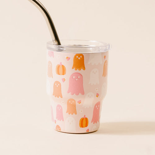 The Darling Effect's Ghost Party 2 oz Tiny Tumbler features a cream background with orange, pink, and white ghosts, pumpkins, and candy corn plus a metal straw—perfect for Halloween!.