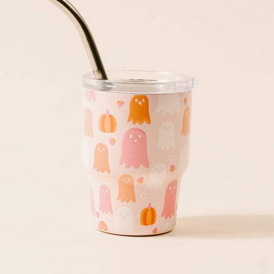 The Darling Effect's Ghost Party 2 oz Tiny Tumbler features a cream background with orange, pink, and white ghosts, pumpkins, and candy corn plus a metal straw—perfect for Halloween!.
