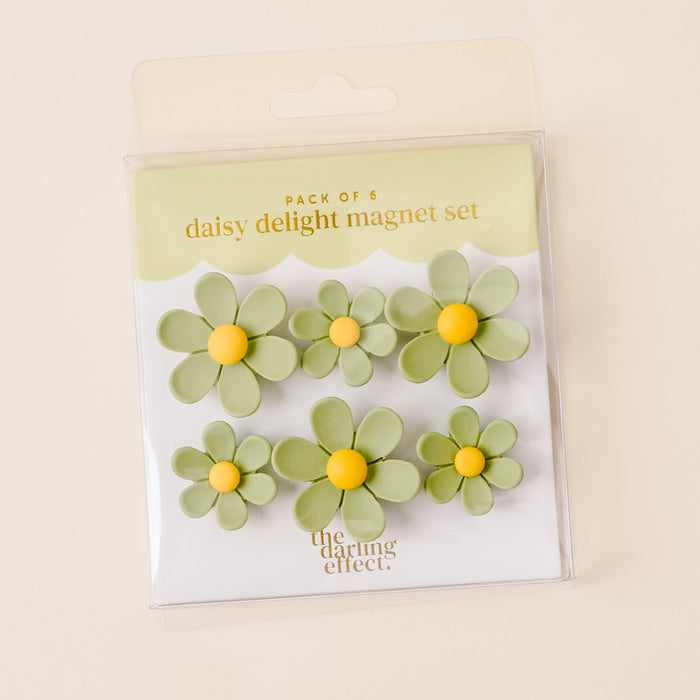 The Green Daisy Delight Magnet Set by the-darling-effect features six vibrant green and yellow magnets with a strong hold, displayed on a light beige background.