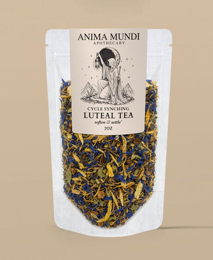 A stand-up pouch of Anima Mundi Apothecary Cycle Synching Luteal Tea, featuring a cream-colored label with black text and an illustration of a woman holding a moon lamp, set against a solid beige background.