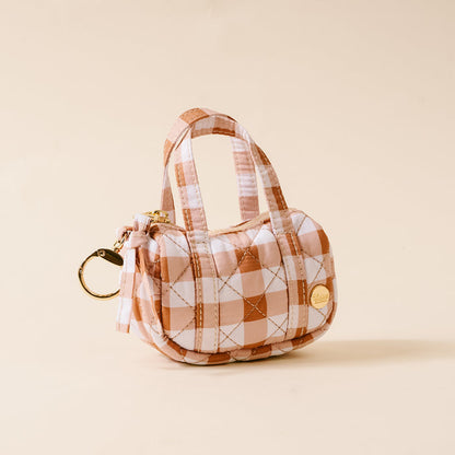Mini gingham duffle bag charm with gold keyring and hardware, orange-and-white plaid