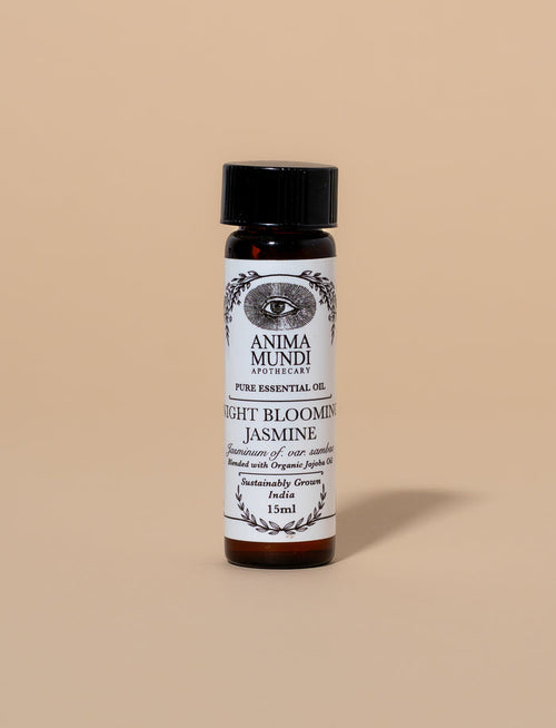 Bottle of Anima Mundi Night Blooming Jasmine essential oil on a beige background