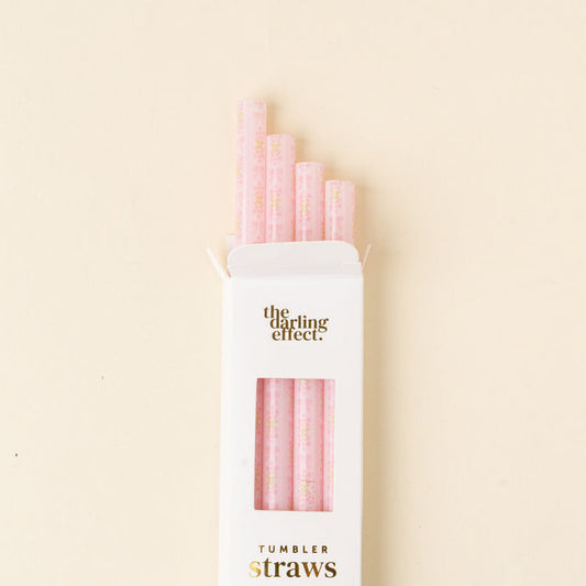 The-darling-effect’s Oh So Fancy Pink 40 oz Tumbler Straw Set includes four BPA-free pink reusable straws with floral patterns and gold accents, packaged in a white box labeled "the darling effect." and "TUMBLER straws".
