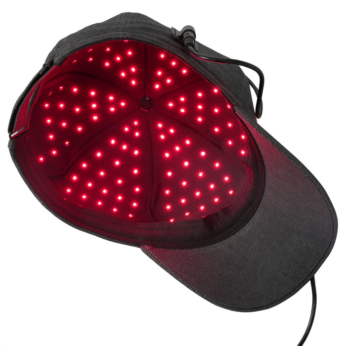 Underside of the black Hooga Red Light Therapy Hat, showing illuminated red LEDs lining the inside of the cap.