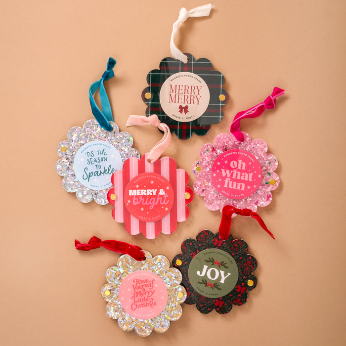 Six scalloped-edge holiday gift tags with festive messages, arranged with ribbon loops—perfect to pair with The Darling Effect’s Peppermint Stripes Scalloped Round Picture Frame Ornament for gifting.