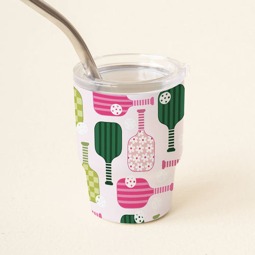 The-darling-effect's Pickleball Party 2 oz Tiny Tumbler features a clear lid, metal straw, and whimsical green and pink pickleball paddle and ball pattern on white—perfect for enjoying your favorite mini drinks!.