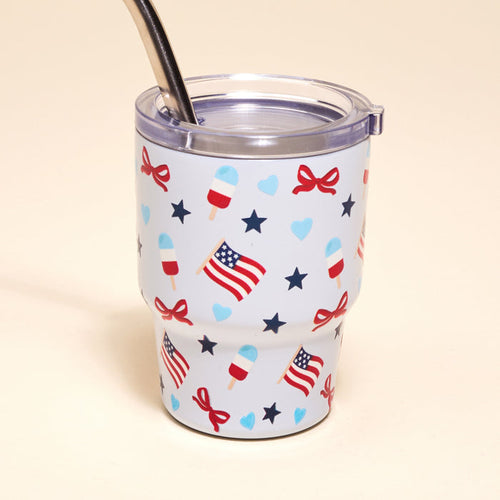 The Darling Effect's Red, White, & Bows 2 oz Tiny Tumbler features a metal straw and American flag, star, heart, bow, and popsicle designs—patriotic and fun!.