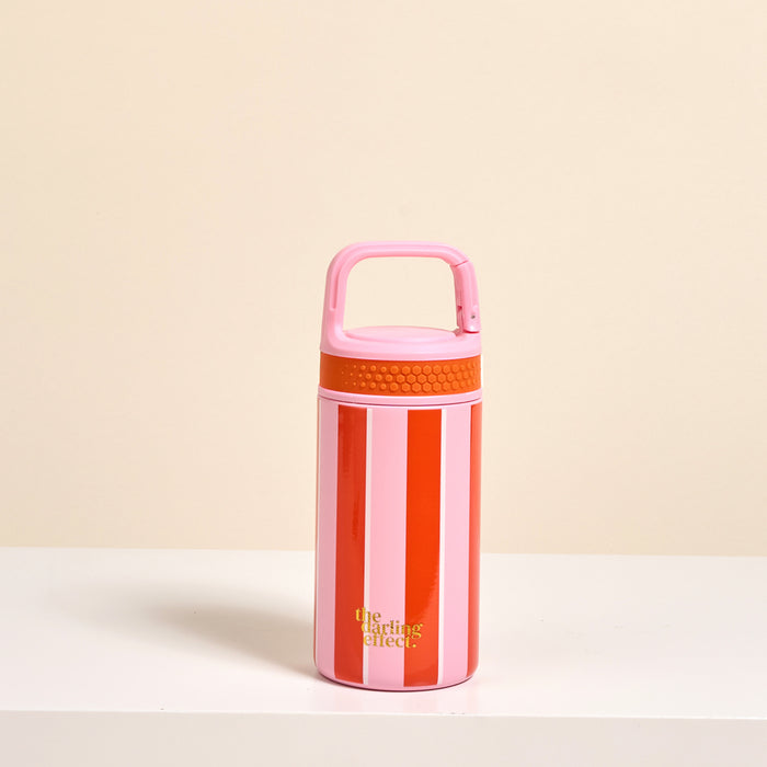 The Darling Effect’s Sicily Stripes Pink 6 oz Lil’ Bitty Bottle features red and pink stripes, a pink handle, and a yellow logo—your ideal travel hydration companion that pops on any white surface with a beige backdrop.