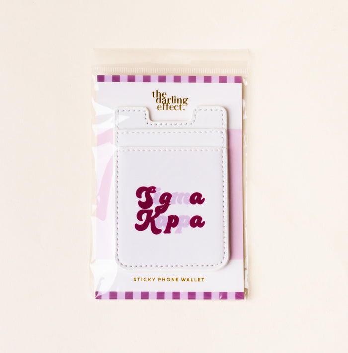 The Darling Effect's Sigma Kappa Stick-On Phone Wallet features purple and pink lettering—a perfect sorority gift for any sister.
