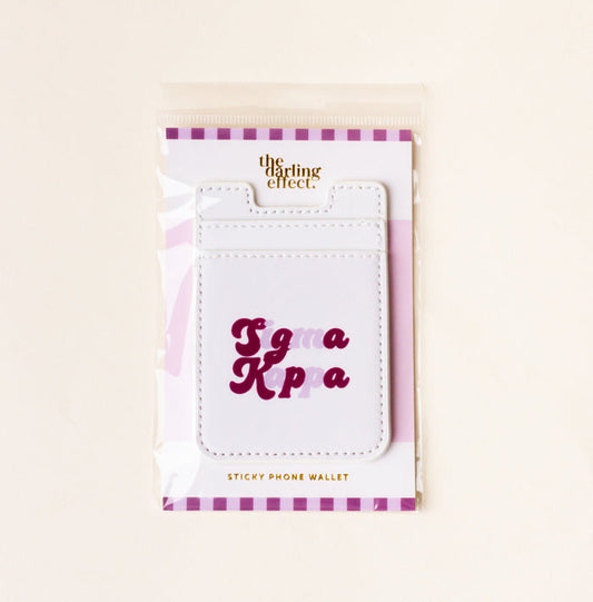 The Darling Effect's Sigma Kappa Stick-On Phone Wallet features purple and pink lettering—a perfect sorority gift for any sister.