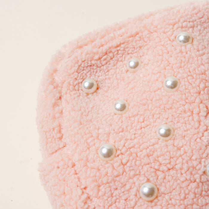 Close-up of the Square Pearl Blush Teddy Pouch by The Darling Effect, featuring soft pink sherpa with scattered white faux pearls—ideal for adding a chic touch to your accessory collection.