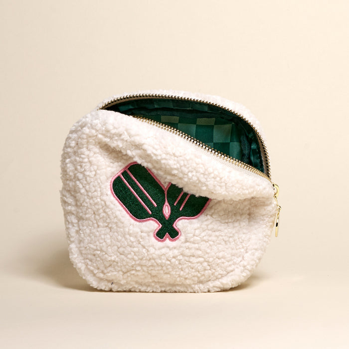 The Square Pickleball Paddles Teddy Pouch by the-darling-effect features white sherpa fabric with a pink and green paddle embroidery, an open zipper, and a green checkered lining—an ideal trendy accessory for your teddy pouch collection.