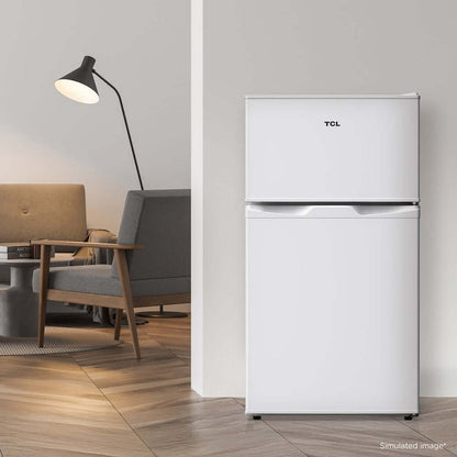 TCL 18 in. 3.1 Cu. Ft. Compact Top Freezer Mini Fridge in White (TRM31D4AW) in a modern living room setting