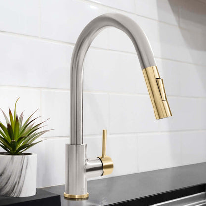 ZLINE Autograph Edition Gemini Pull Down Single Handle Kitchen Faucet in Brushed Nickel and Champagne Bronze (GEM-KF-ZBNCB) in a kitchen with a white tiled wall.